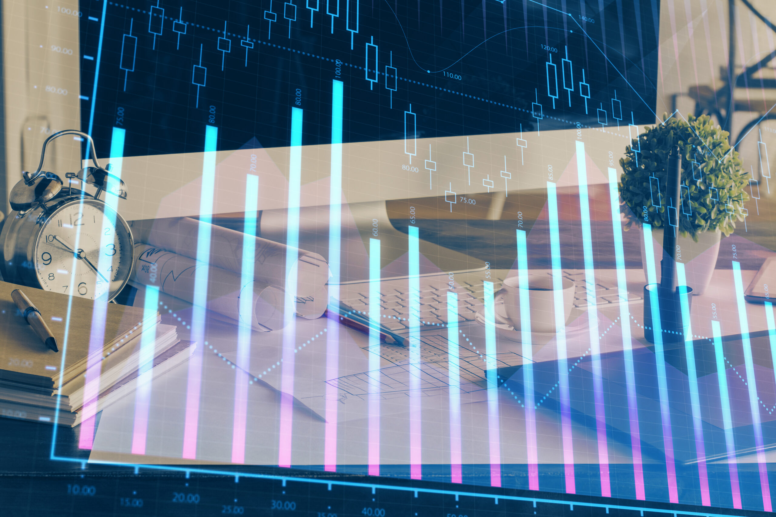 Gráficos financeiros sobrepostos a uma estação de trabalho com computador e documentos, representando análise de indicadores de desempenho, gestão contábil e tomada de decisões baseada em dados.